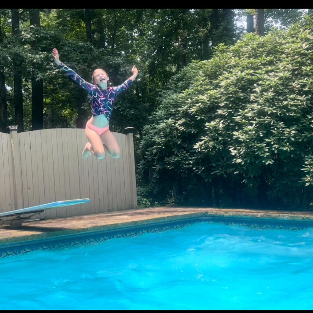 Girl Jumping into pool